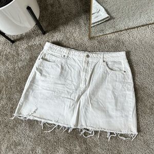 Distressed denim mini skirt